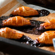 Failed Croissants on tray with filling leaking out